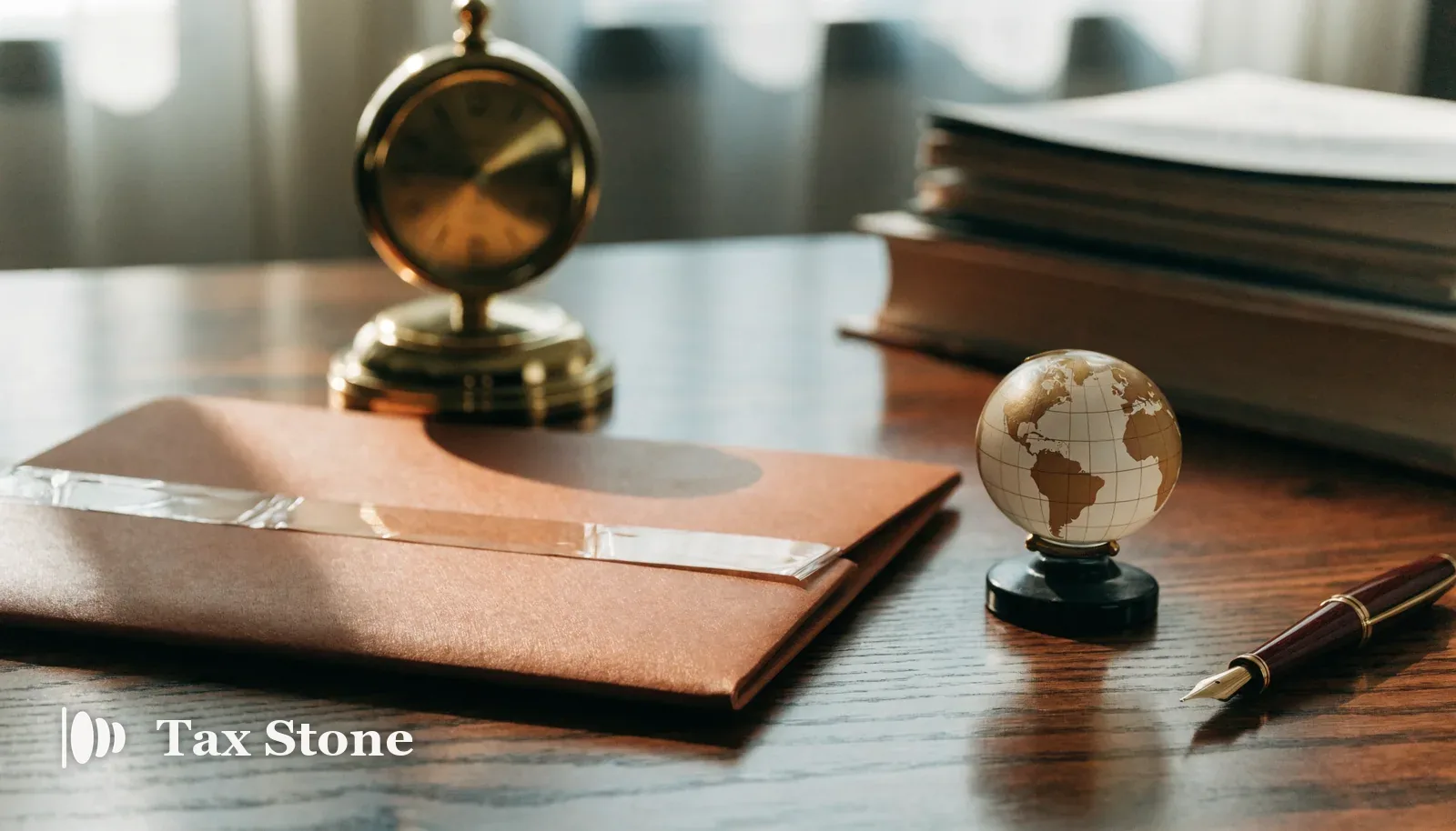 TaxStone hero image — a brass desk clock, a sealed disclosure folder and a globe paperweight on a walnut desk in warm terracotta light, representing the 90-day Worldwide Disclosure Facility deadline