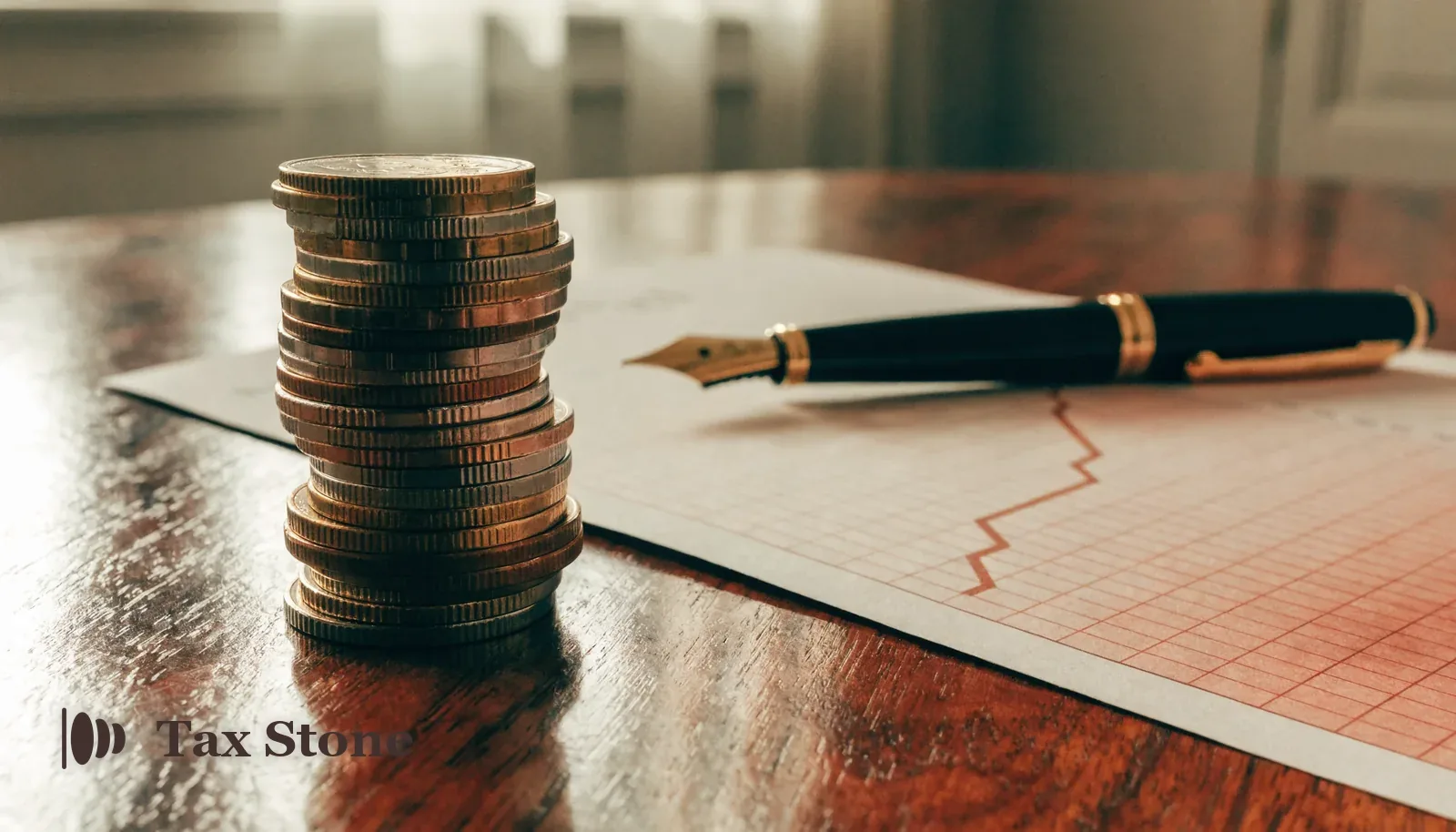 Stack of British pound coins beside a rising financial chart and a fountain pen — TaxStone UK Capital Gains Tax calculator