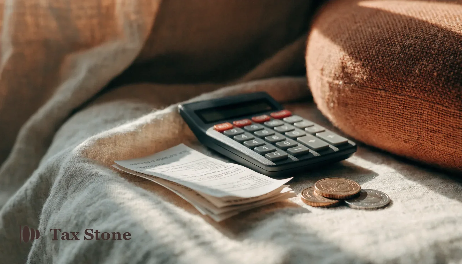Paper receipts, a calculator and British pound coins — TaxStone UK VAT calculator
